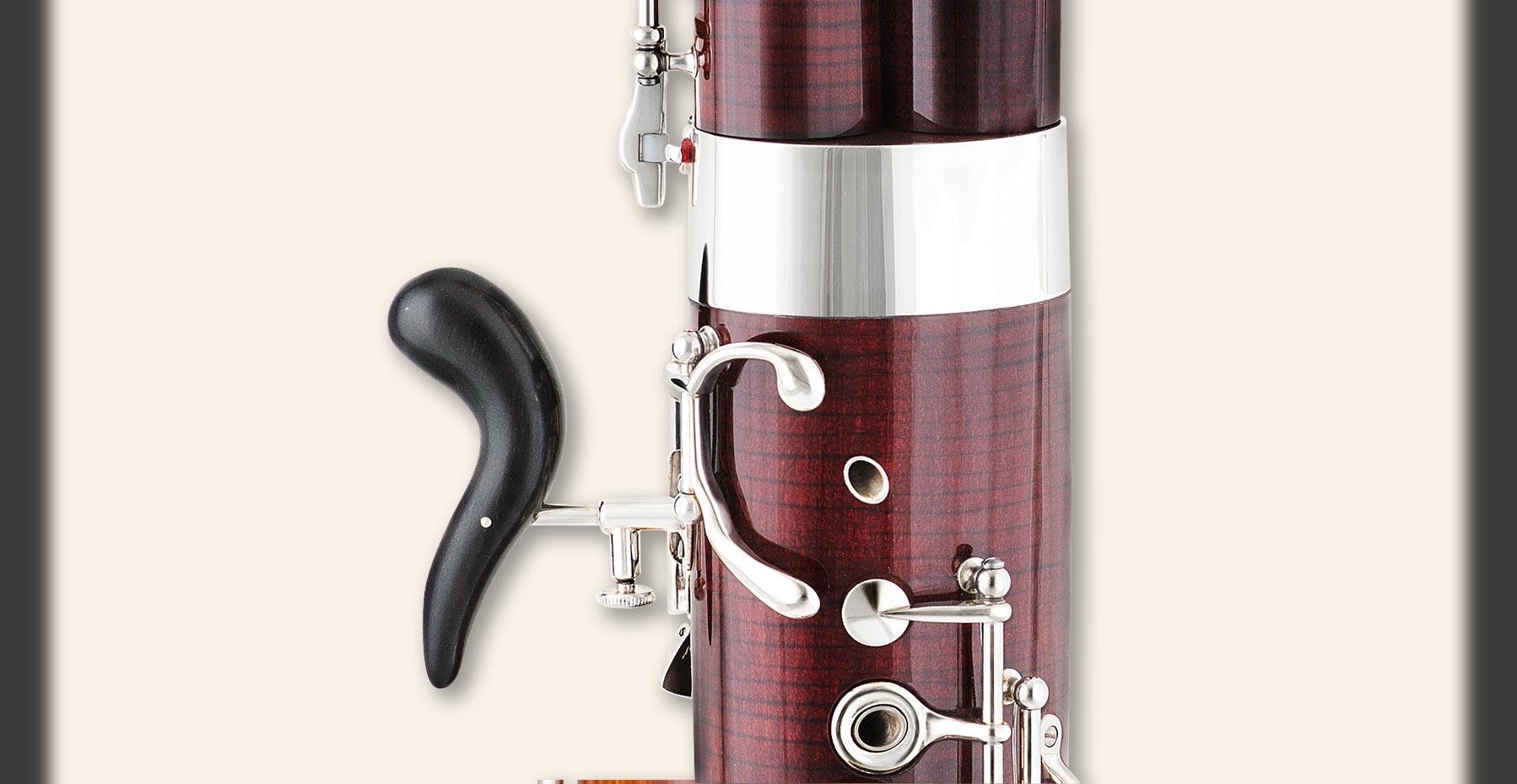 Double C# key on boot joint and gliding roller on link between low-E key and whisper-key mechanism